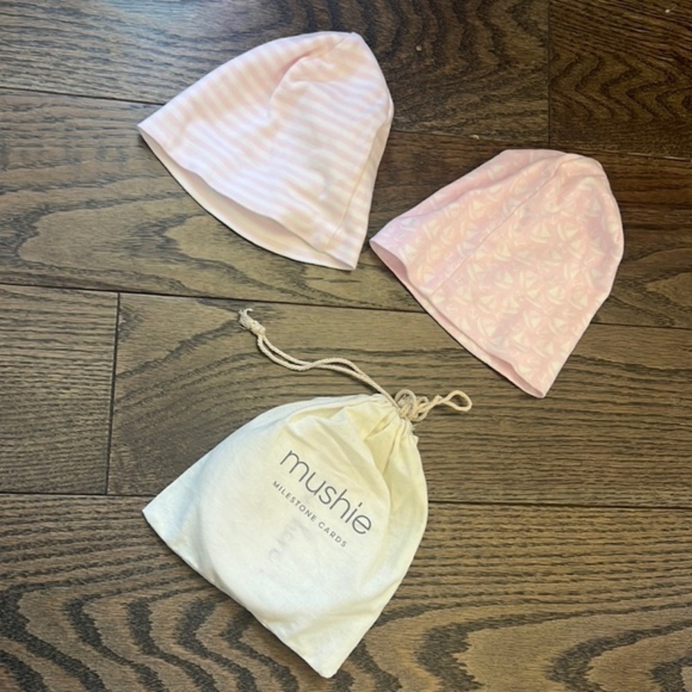 Set of two kissy kissy newborn baby hats and mushie milestone cards
